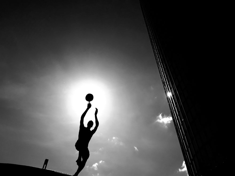 Man kicking soccer ball